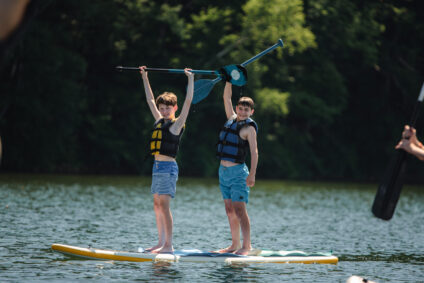campers on paddleboards