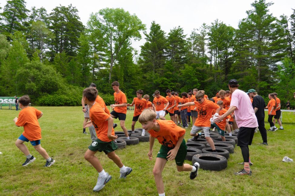 orange team going through an obstacles course for the founder's cup