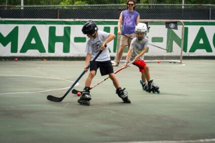 campers playing hockey on skates